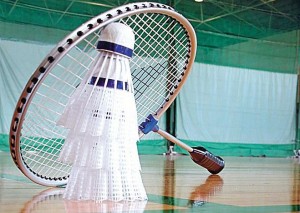 Perspective in a sports hall wth shuttlecocks and badminton racket